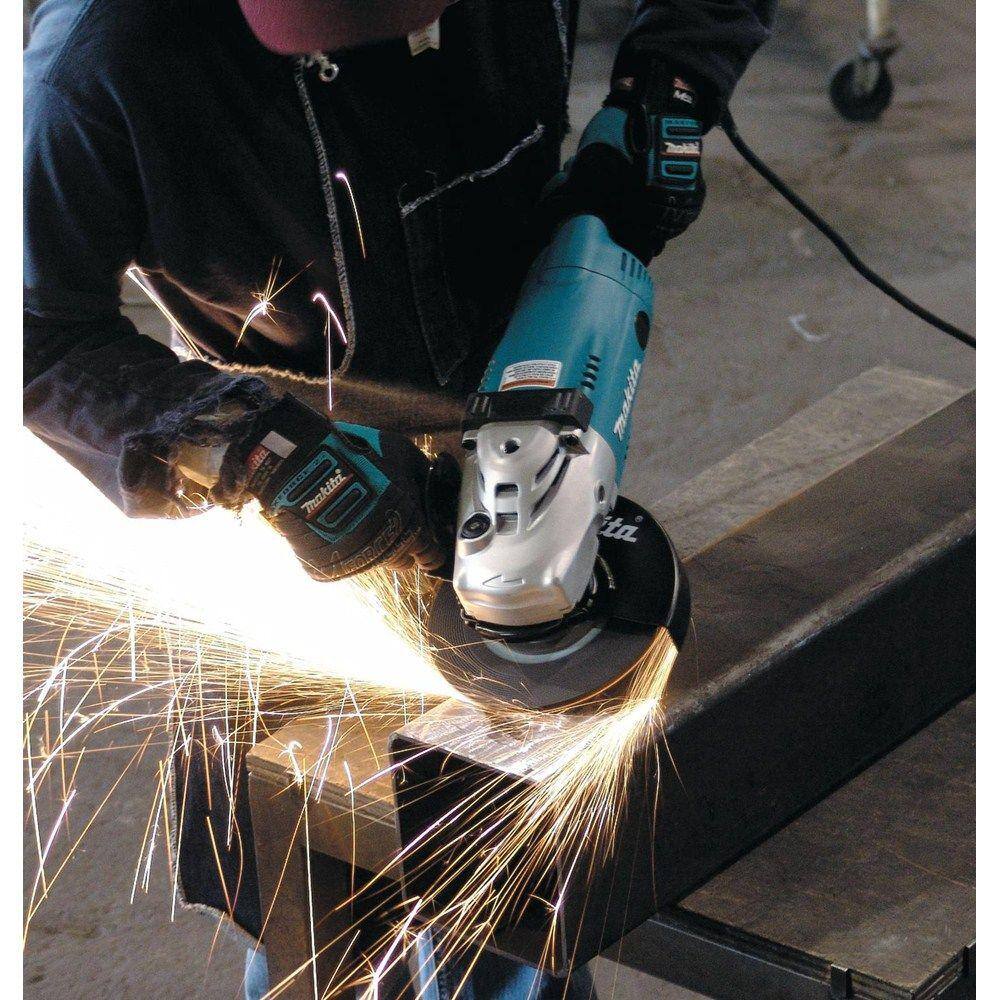 Makita 15 Amp 7 in. Corded Angle Grinder with Grinding wheel Side handle and Wheel Guard GA7021