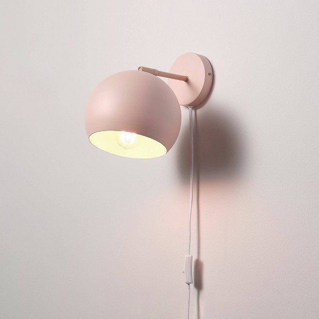 Molly 1 light Matte Pink Plug in Or Hardwire Wall Sconce With Faux Wood Accent Globe Electric