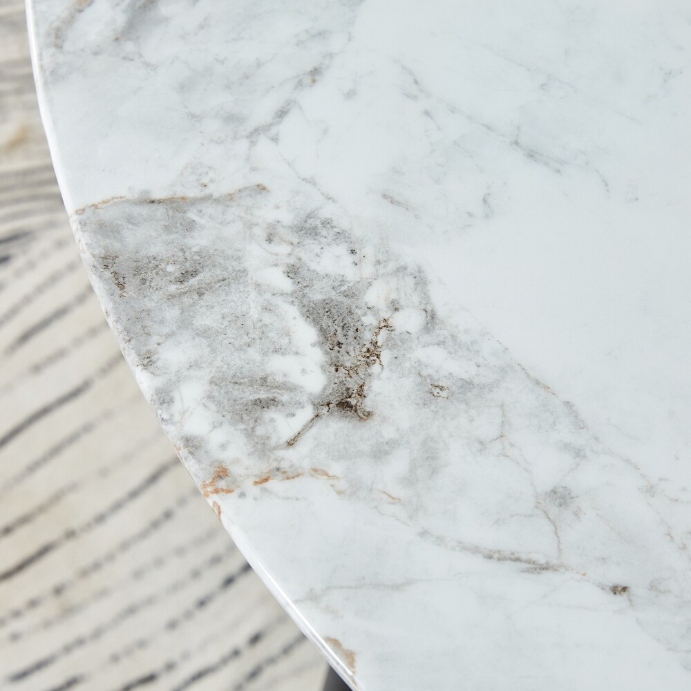 A modern circular dining table with a 0.3 inch thick white imitation marble pattern tabletop and black metal legs