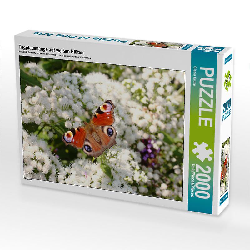 Tagpfauenauge auf weißen blüten - calvendo foto-puzzle