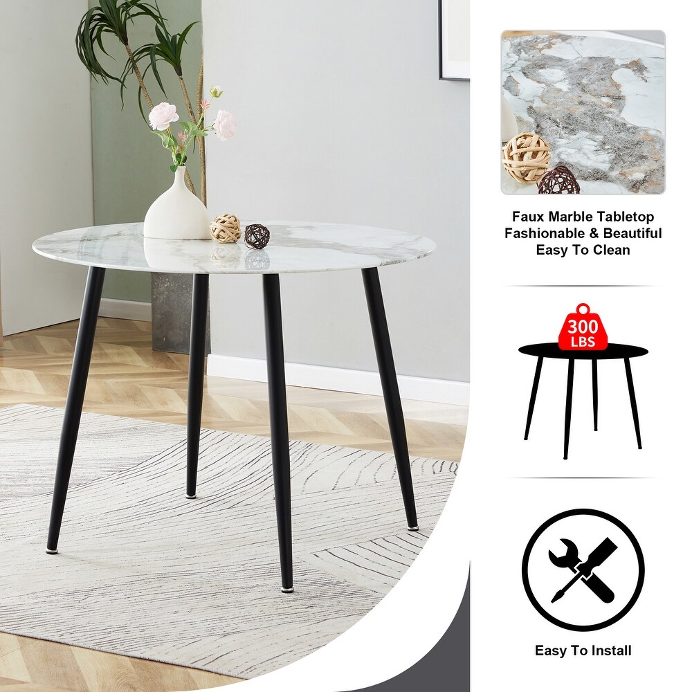 A modern circular dining table with a 0.3 inch thick white imitation marble pattern tabletop and black metal legs