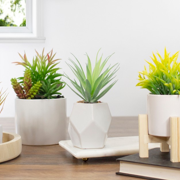 Green Artificial Sword Grass In A White Geometric Pot