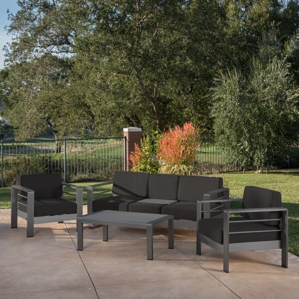 Cape Coral Outdoor Aluminum Tempered Glass 4piece Sofa Chat Set with Cushions by Christopher Knight Home