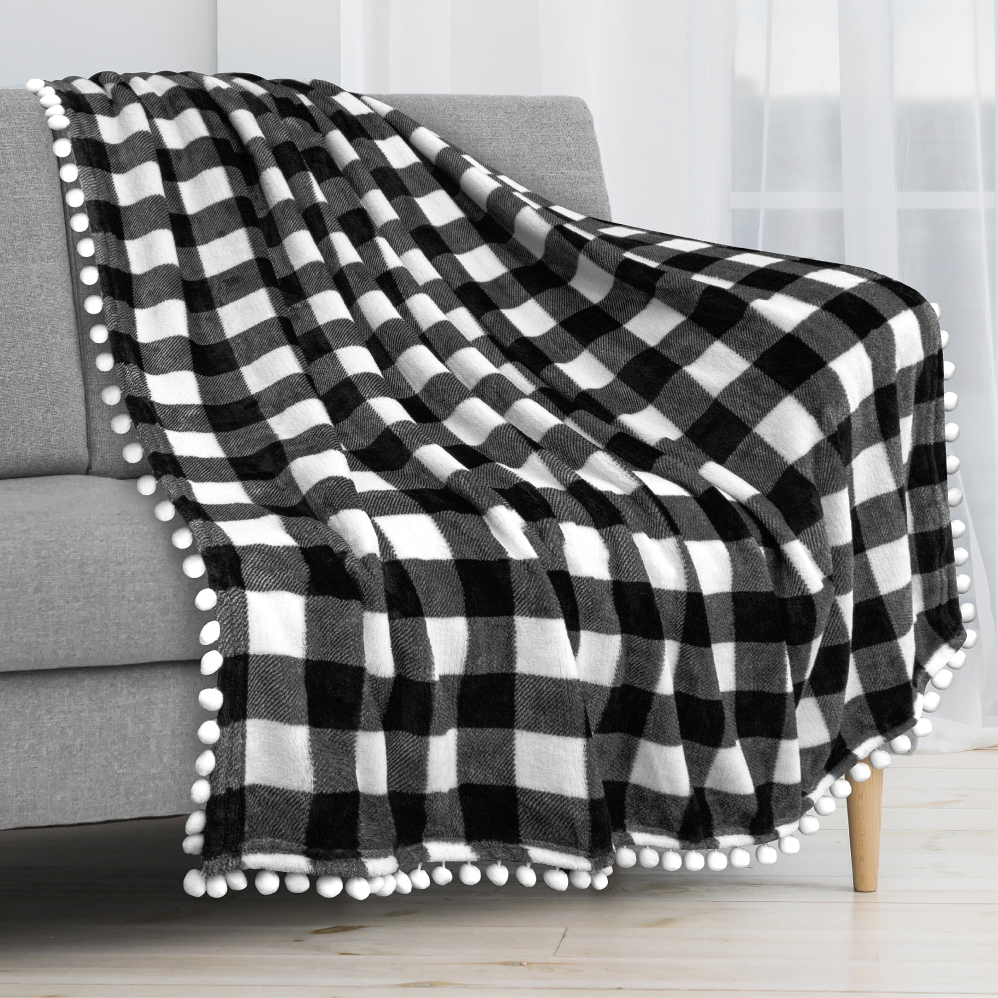 PAVILIA Fleece Throw Blanket with Pom Pom Fringe | Buffalo Plaid Checkered White， Black Flannel Throw | Super Soft Lightweight Microfiber Polyester | Plush， Fuzzy， Cozy | 50 x 60 Inches