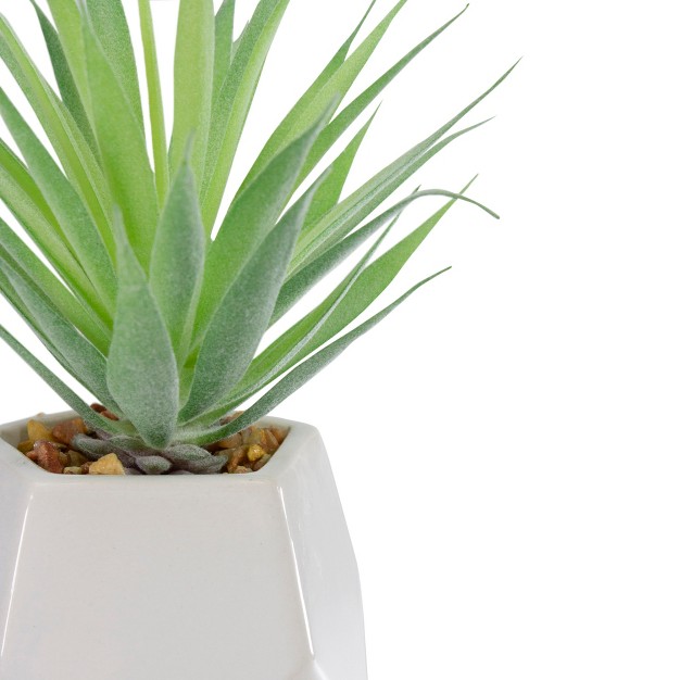 Green Artificial Sword Grass In A White Geometric Pot