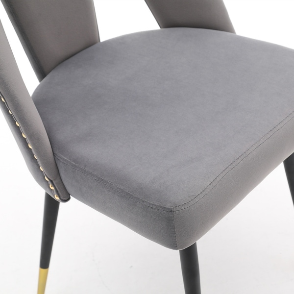 Contemporary Velvet Upholstered Dining Chair with Nailheads and Gold Tipped Black Metal Legs Set of 2