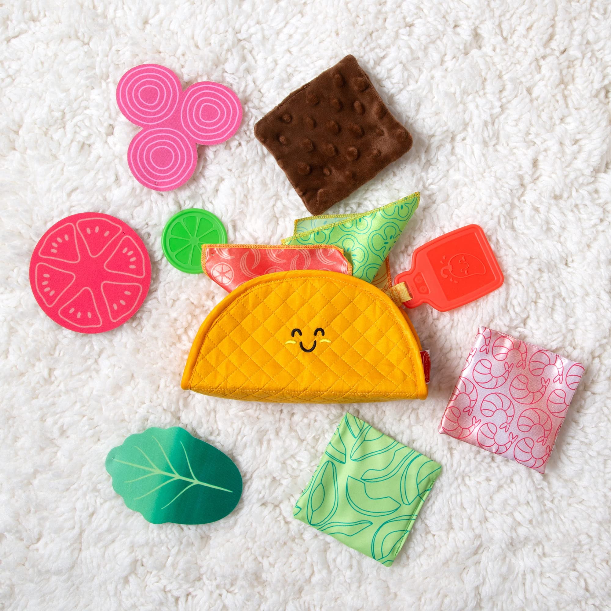 Melissa and Doug Multi-Sensory Soft Taco Fill and Spill Infant Toy