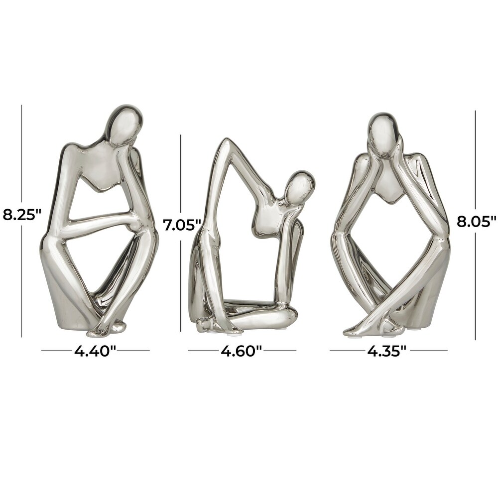 CosmoLiving by Cosmopolitan Silver or Gold Porcelain Sitting Thinker People Sculpture (Set of 3)