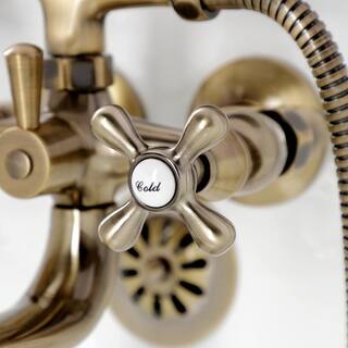 Kingston Brass Kingston 2-Handle Wall-Mount Clawfoot Tub Faucets with Handshower in Antique Brass HKS225AB