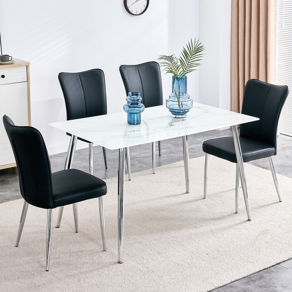 Table and chair set. 1 table with 4 black PU chairs. Modern minimalist rectangular white imitation marble dining table