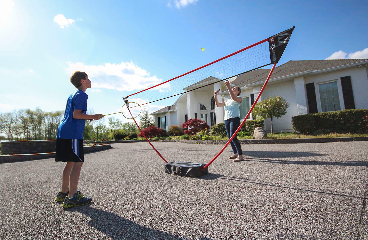 Zume Games Portable Badminton Set with Freestanding Base Sets Up on Any Surface in Seconds. No Tools or Stakes Required