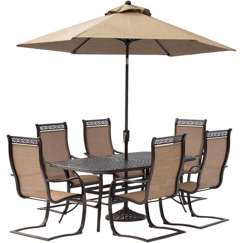 Hanover Manor 7-Piece Outdoor Dining Set In Tan/Bronze With 6 Spring Chairs， 72 x 38 Cast-Top Table， Umbrella， Base