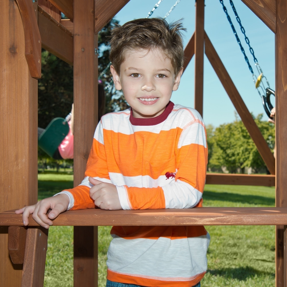 Swing N Slide Jamboree Fort Wooden Swing Set w/ Rock Wall  Picnic Table and Awning   13' W x 13' L x 9' 6\