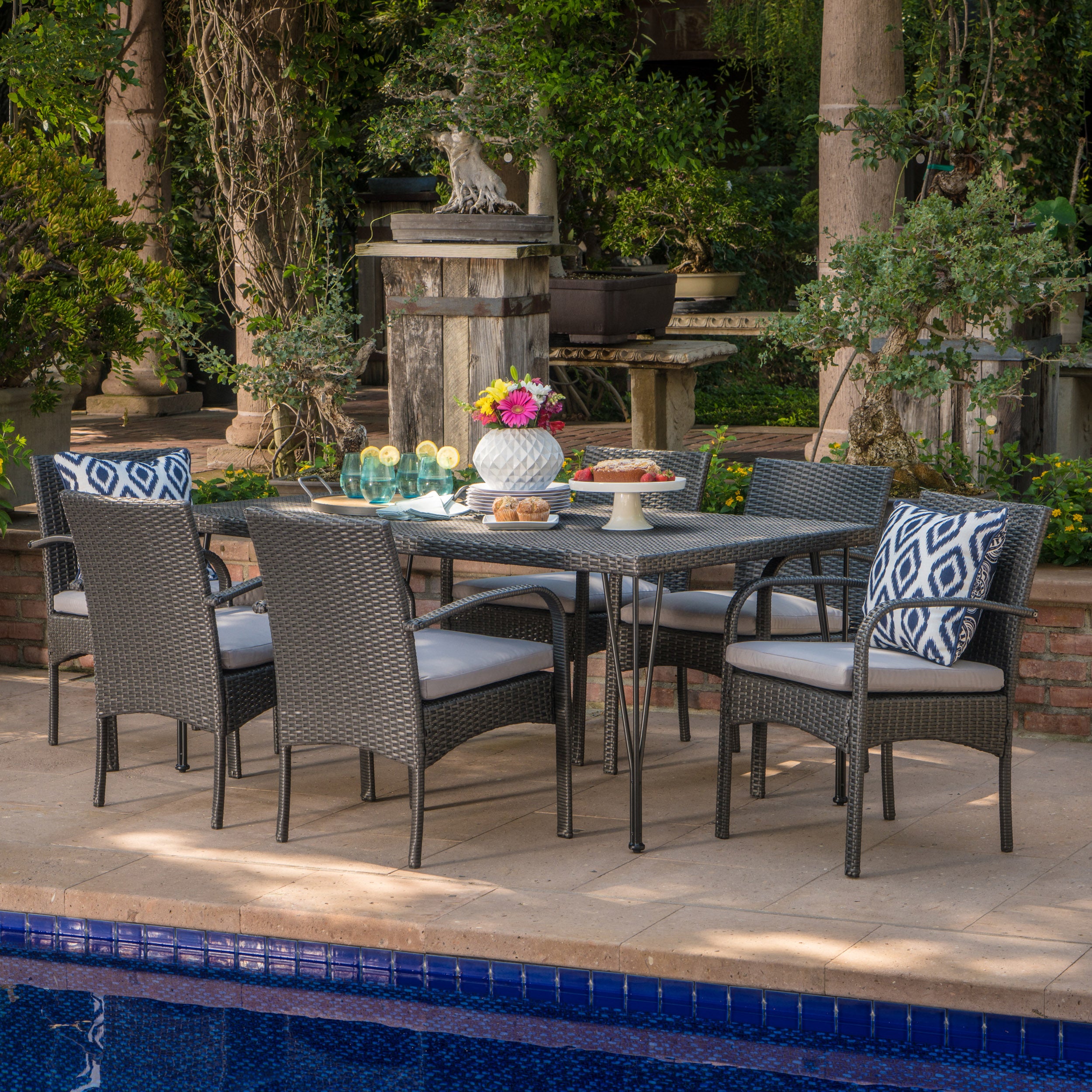 Kari Outdoor 7 Piece Wicker Rectangular Dining Set with Water Resistant Cushions