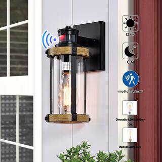 C Cattleya 1-Light Black and Woodgrain Motion Sensing Dusk to Dawn Outdoor Wall Sconce with Striped Clear Glass CA1930-W