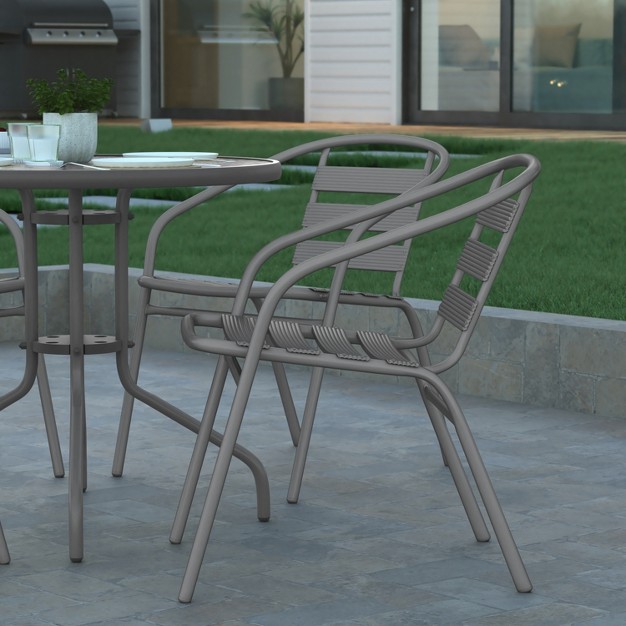 Emma And Oliver 31 5 x27 x27 Round Glass Top Metal Table With 4 Aluminum Slat Stack Chairs