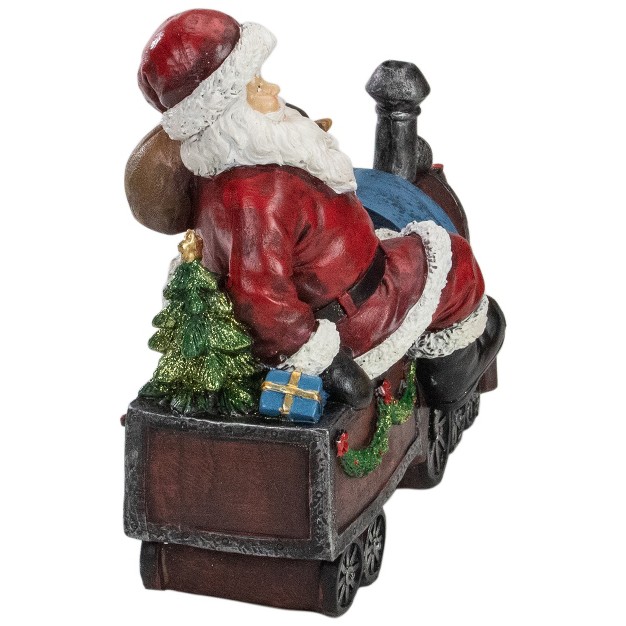 Red And Blue Santa On A Train Christmas Tabletop Decoration