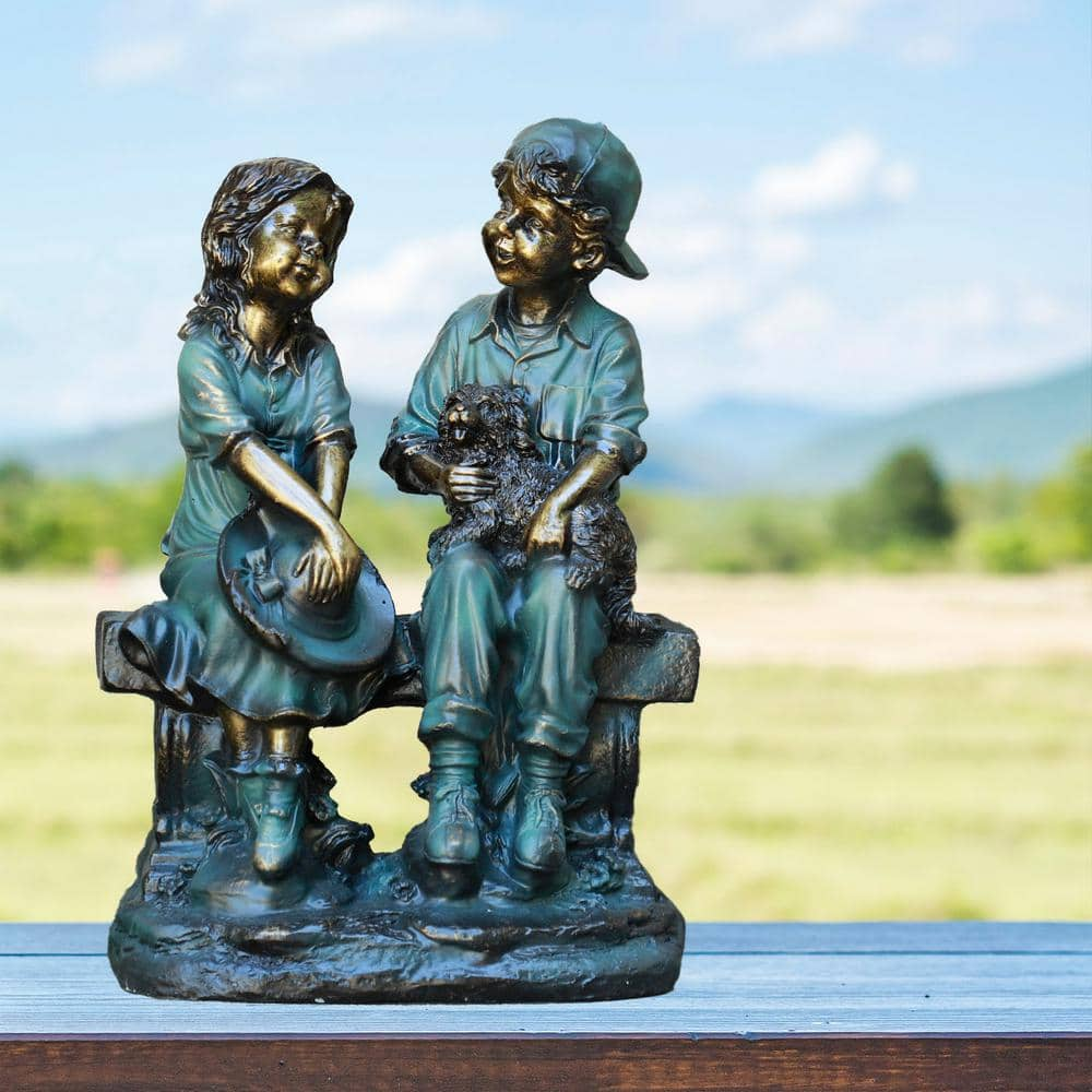 Alpine Corporation 16 in. Tall Indoor/Outdoor Girl and Boy Sitting on Bench with Puppy Statue Yard Art Decoration GXT264