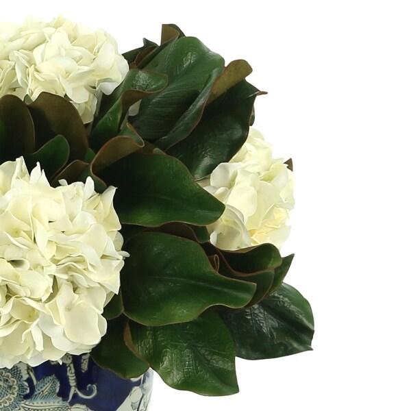 Hydrangea and Magnolia Leaf Arrangement in a Decorative Vase